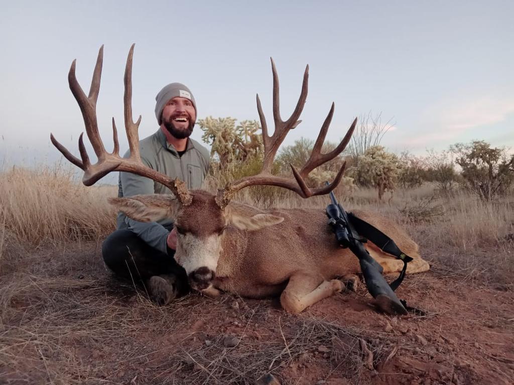 Hunter with trophy deer